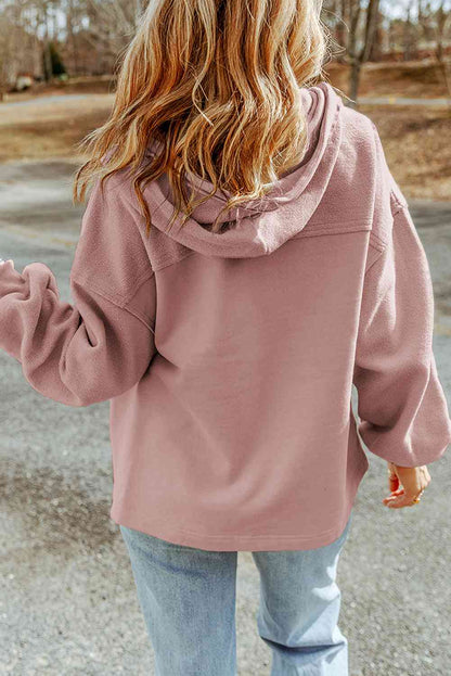 Woman in cozy pink hoodie and blue jeans enjoying a casual stroll outdoors. Perfect for a relaxed, everyday style. #StreetStyle #CasualWear #FashionGoals