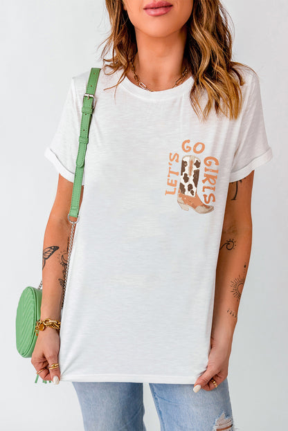 Woman in casual white tee with "Let's Go Girls" print, green strap handbag, and ripped denim jeans, trendy fashion.